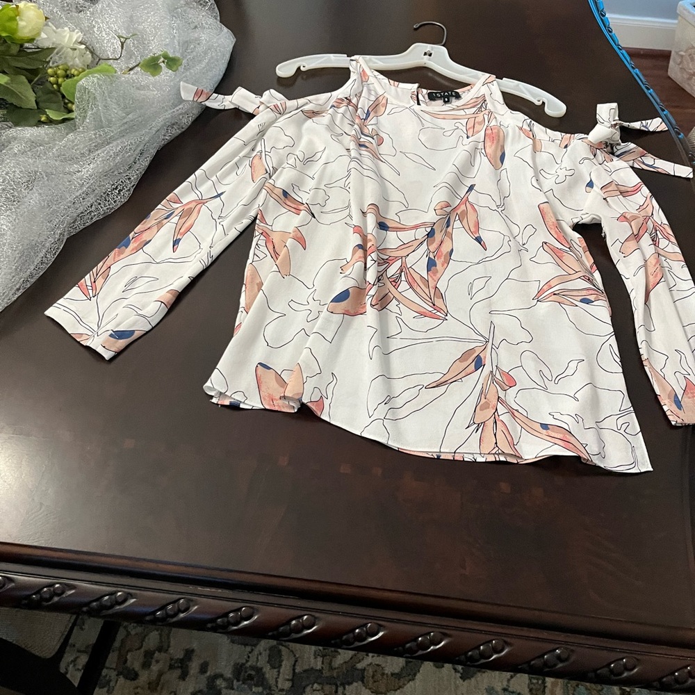 1.State white top with flowers size small.